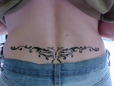 tribal butterfly lower back tattoo