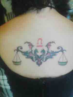 flower and vine tattoos. libra scales with tree or vine