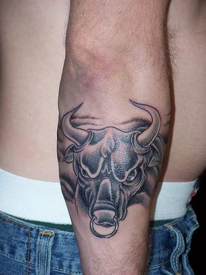 brahma bull tattoo. The Rock is a wrestler turned actor.