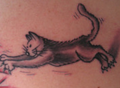 cat eye tattoos for lower back. A stylized cat and a Celtic knot are